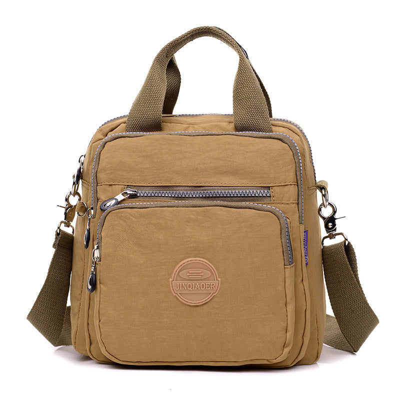 Elegante waterdichte damestas, te dragen als schoudertas of crossbody, perfect voor een georganiseerde dag.