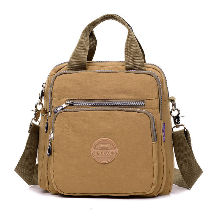 Elegante waterdichte damestas, te dragen als schoudertas of crossbody, perfect voor een georganiseerde dag.