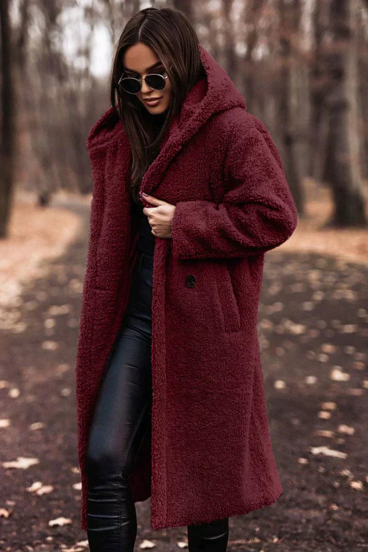 Lange oversized teddyjas voor dames met warme capuchon; ideaal voor winter en comfort. Stijlvolle outwear.