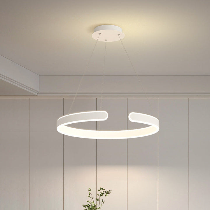 Cirkel LED hanglamp van metaal en acryl, dimbaar. Verrijkt elk modern interieur met zijn unieke design.