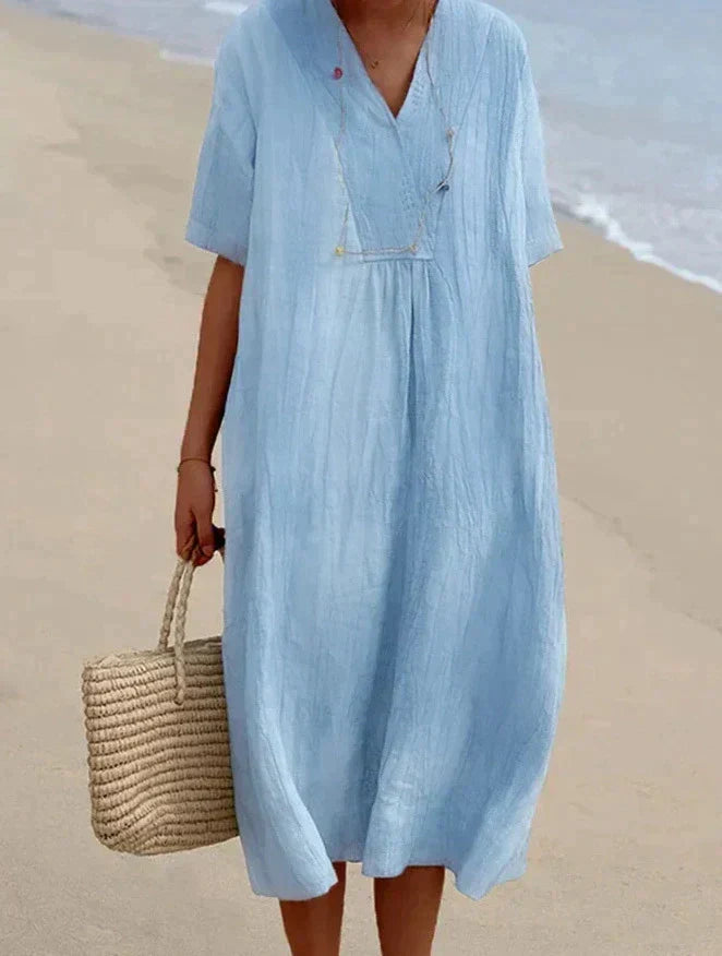 Dames katoen linnen zomerjurk Aria met V-hals en zakken, ideaal voor casual zomercomfort.