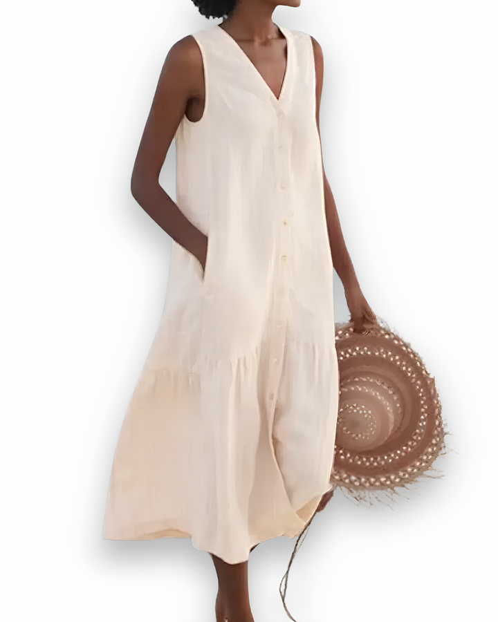 Vrouw draagt comfortabele casual midi zomerjurk, ideaal voor warme dagen en ontspannen momenten.