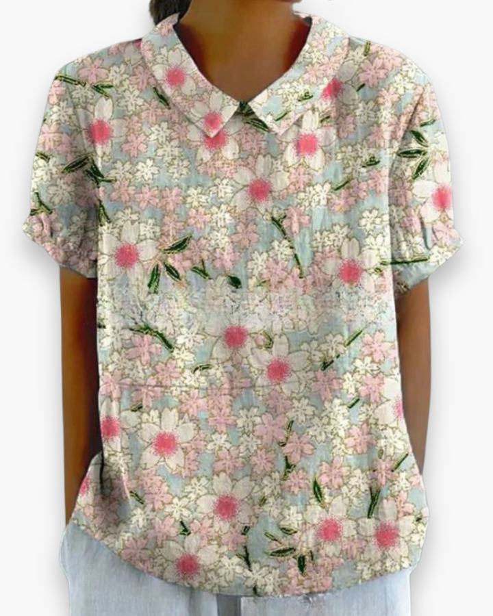 Trendy damesblouse met kleurrijke bloemenprint, een must-have voor zomerse mode en comfort.