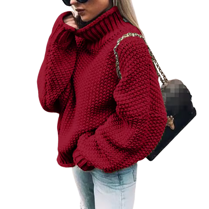 Blijf warm deze winter met deze modieuze gebreide damestrui. Voorzien van een comfortabele en stijlvolle hoge col.