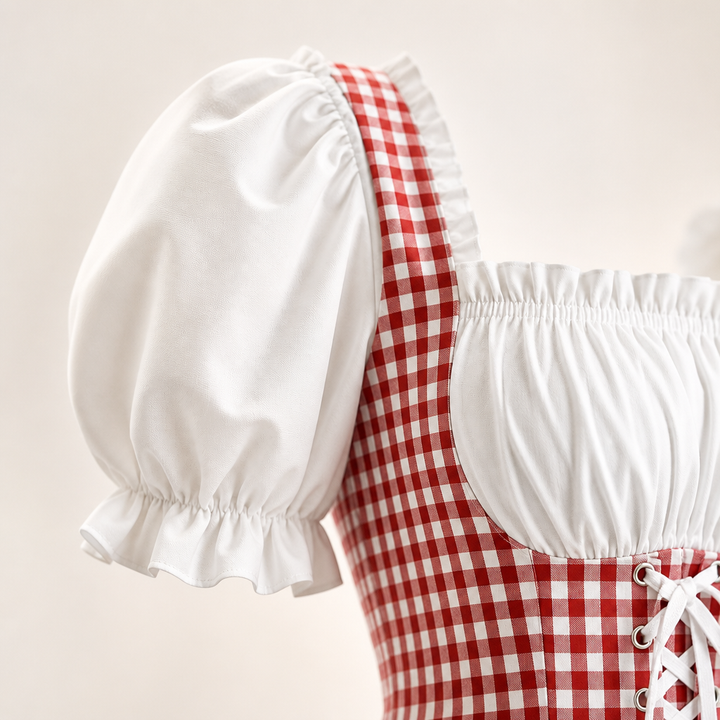 Dames dirndl jurk met opvallende pofmouwen en delicate strikdetails, perfect voor carnaval of Oktoberfest.
