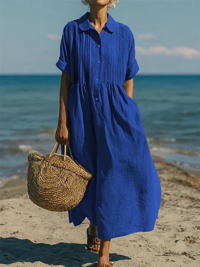 Stijlvolle midi zomerjurk voor dames, met elegante knoopsluiting en korte mouwen.