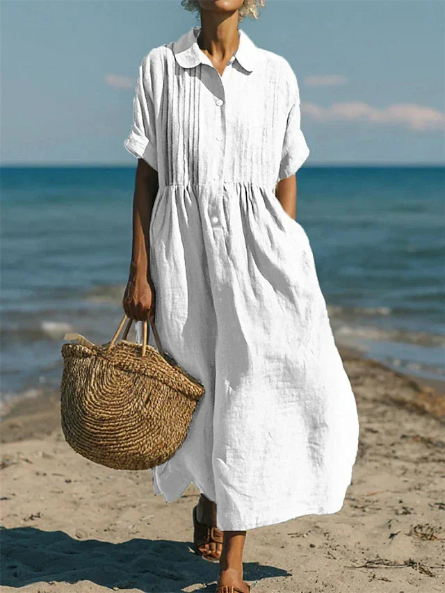 Elegante dames overhemdjurk, midi lengte, met stijlvolle knoopsluiting. Perfect voor lente en zomer.