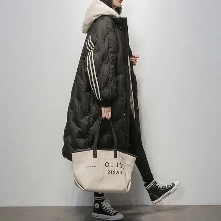 Stijlvolle lange oversized damesjas Kimberly, gewatteerd met capuchon, moderne buitenmode voor een casual look.