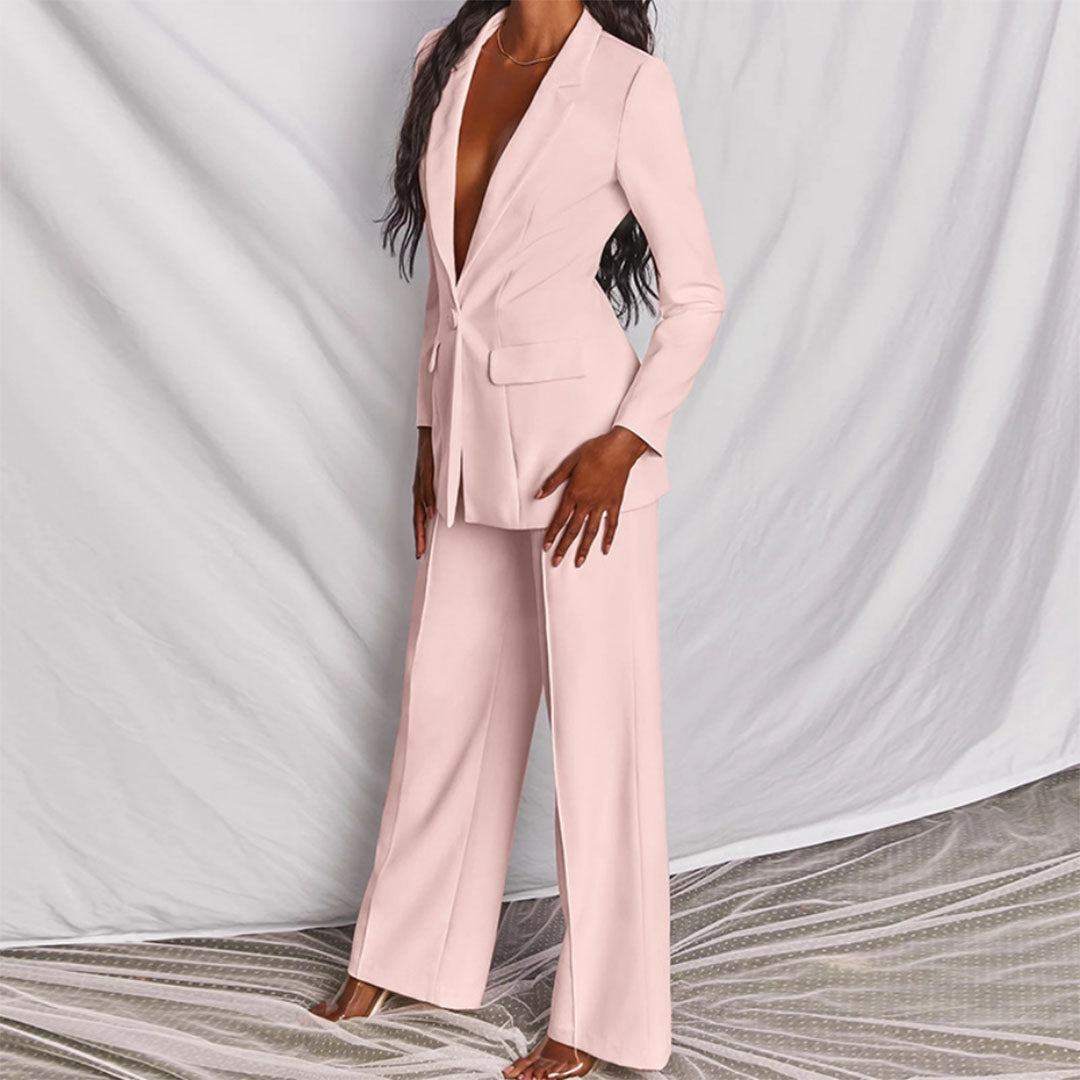 Comfortabel en stijlvol damespak, tweedelig. Modieuze blazer en pantalon, ideaal voor een elegante kantoorlook.