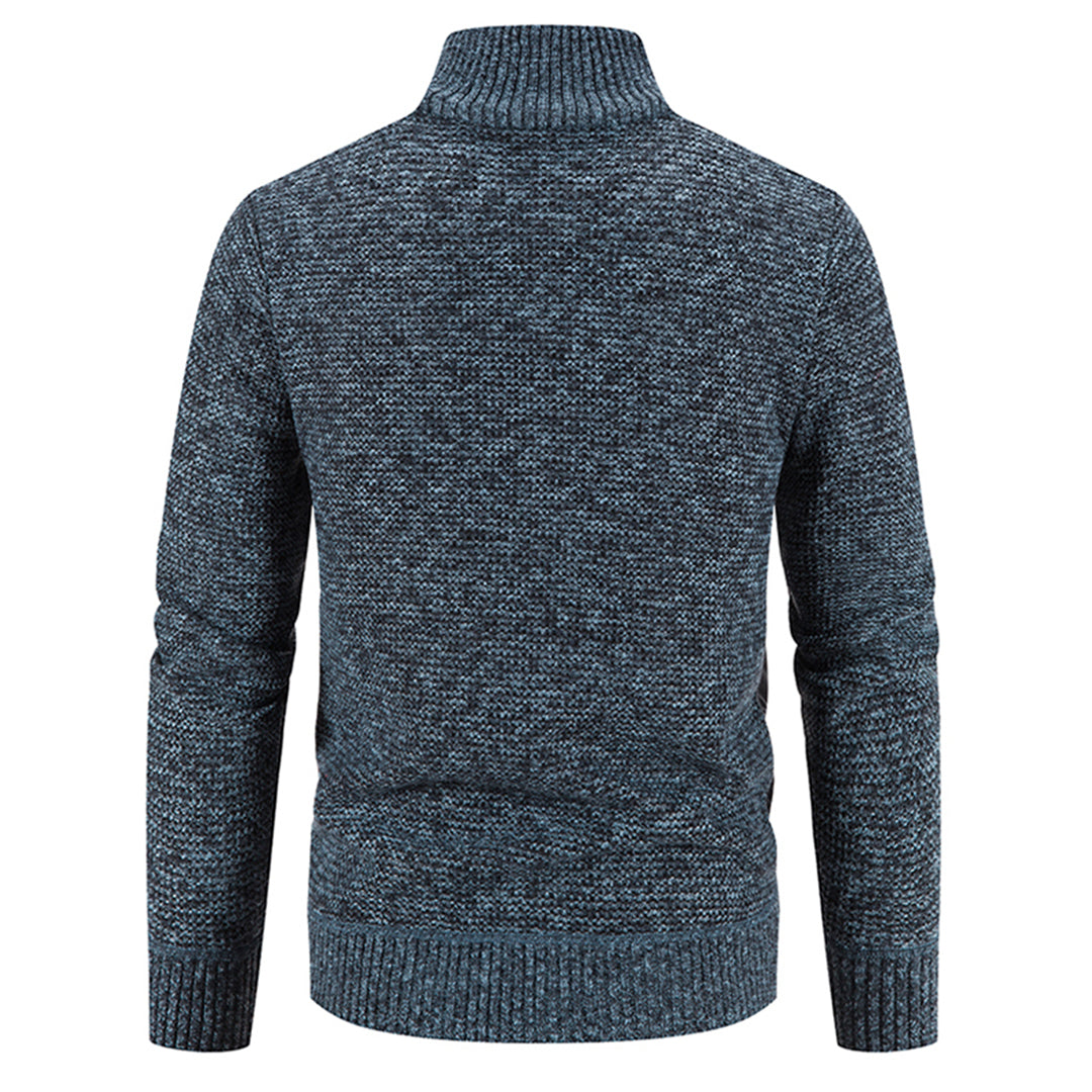 Opgevouwen heren trui vest met rits, toont de zachte textuur en nette afwerking.