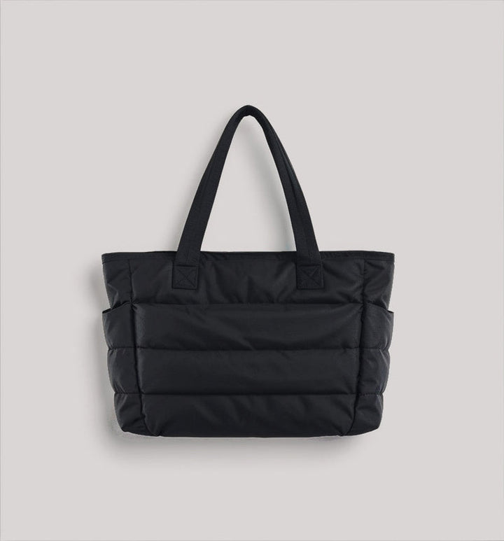 Unisex puffer schooltas met ruim laptopvak voor dagelijks gebruik. Praktische en modieuze studententas.