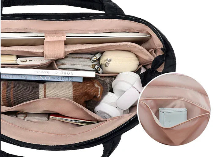 Roze puffer handtas/schooltas met laptopvak. Grote, waterafstotende tas voor school en vrije tijd.