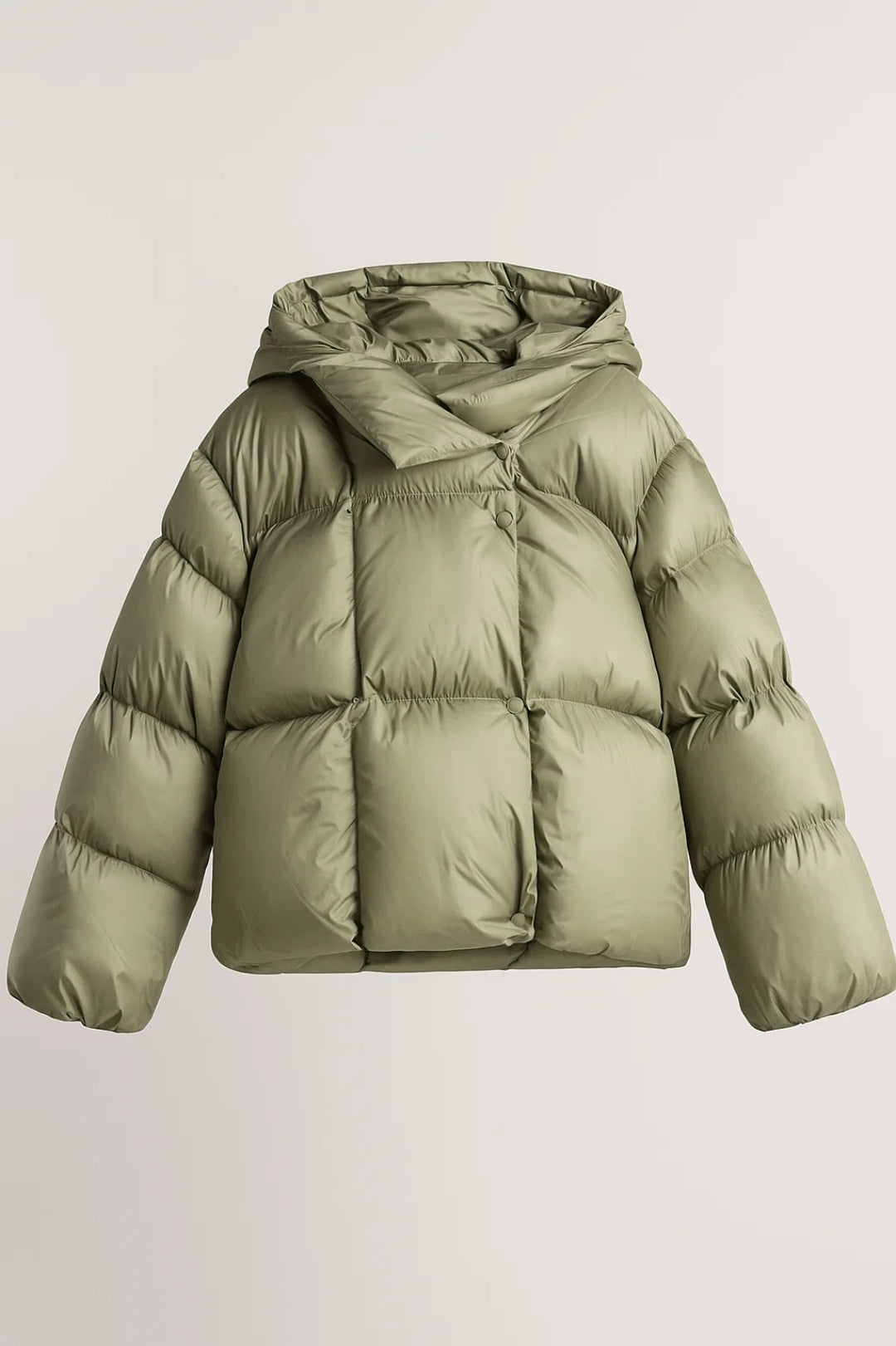 Warm olijfgroen dames pufferjack, trendy en comfortabel. Ideaal als casual buitenkleding voor koude dagen.