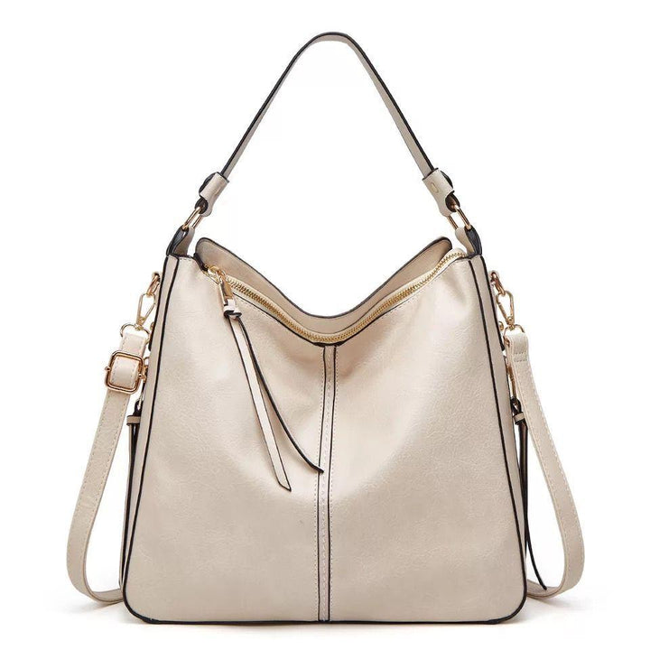 Luxe dames leren crossbody tas met verfijnde gouden accenten, een tijdloze accessoire voor elke outfit.