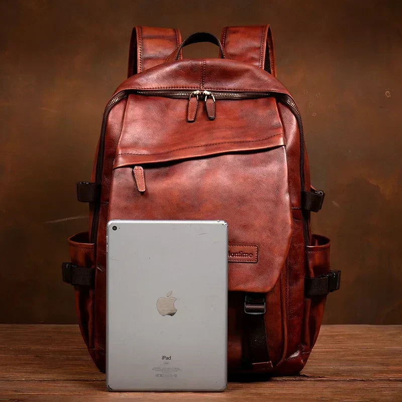 Elegante bordeaux leren zakelijke rugzak van Skinnato, ruim en professioneel voor werk en studie.