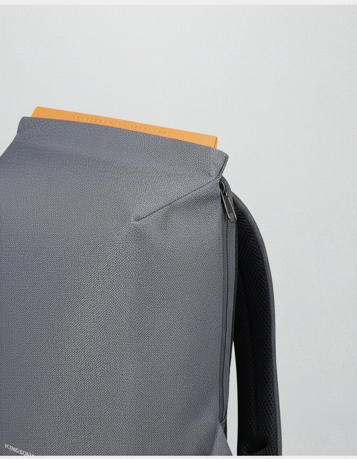 Zakelijke unisex rugzak van donkergrijs leer met anti-diefstal ritsen en ruim interieur voor laptop en documenten.