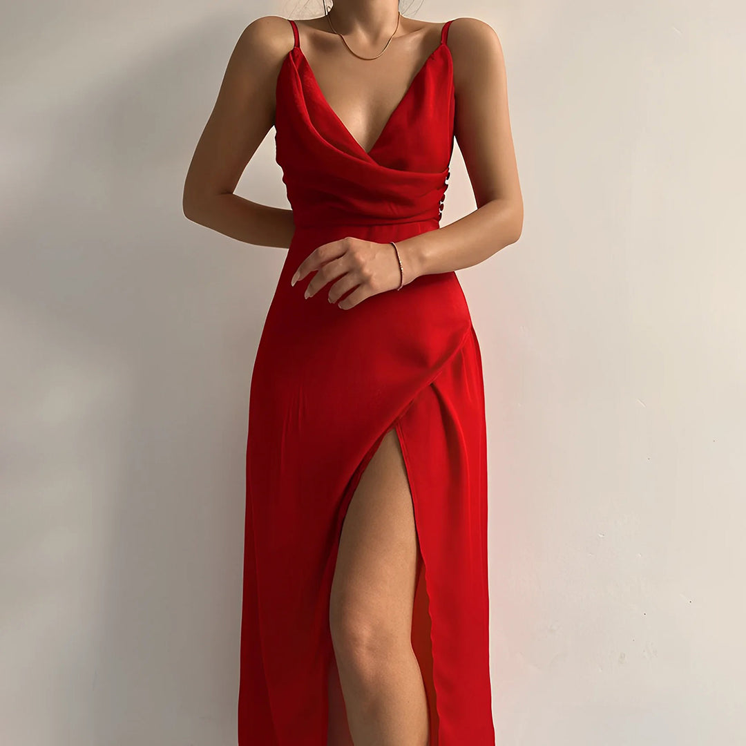 Chique dames midi-jurk met blote rug en sierlijke split. Perfecte zomer- of avondjurk.