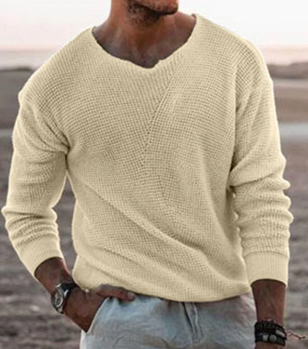 Heren losvallende wafelgebreide trui met V-hals. Comfortabele lange mouwen, perfect voor casual herfst- en winterdagen.
