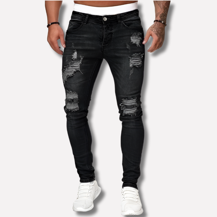 Volledige weergave van de trendy slim fit gescheurde heren spijkerbroek. Casual stretch denim broek voor mannen.