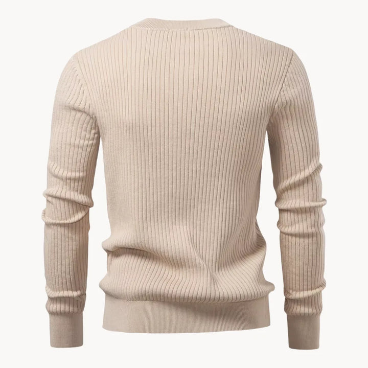 Warme heren trui voor het najaar, geribbelde stof, ronde hals en praktische knoopsluiting.