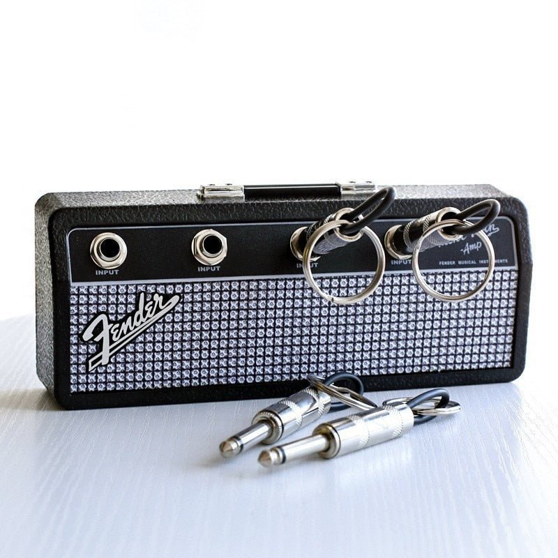 Stijlvolle sleutelhouder met uniek gitaarthema, perfecte wandorganizer voor muziekliefhebbers. Zinklegering design.