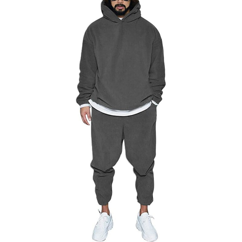 Zwarte heren hoodie en jogger set, een comfortabel en essentieel sportpak.