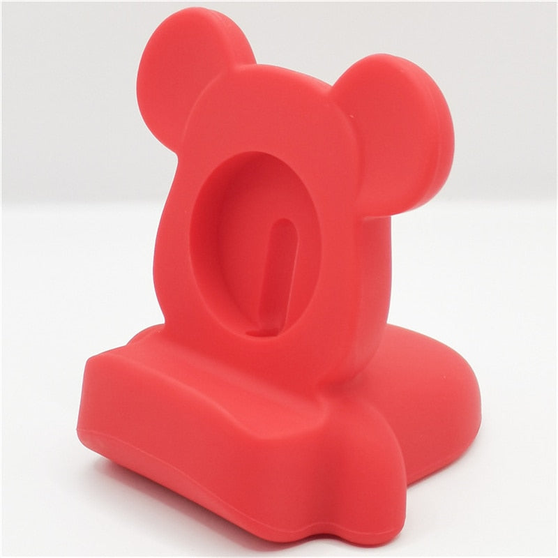 Grijs siliconen Apple Watch oplader dock voor bureau.