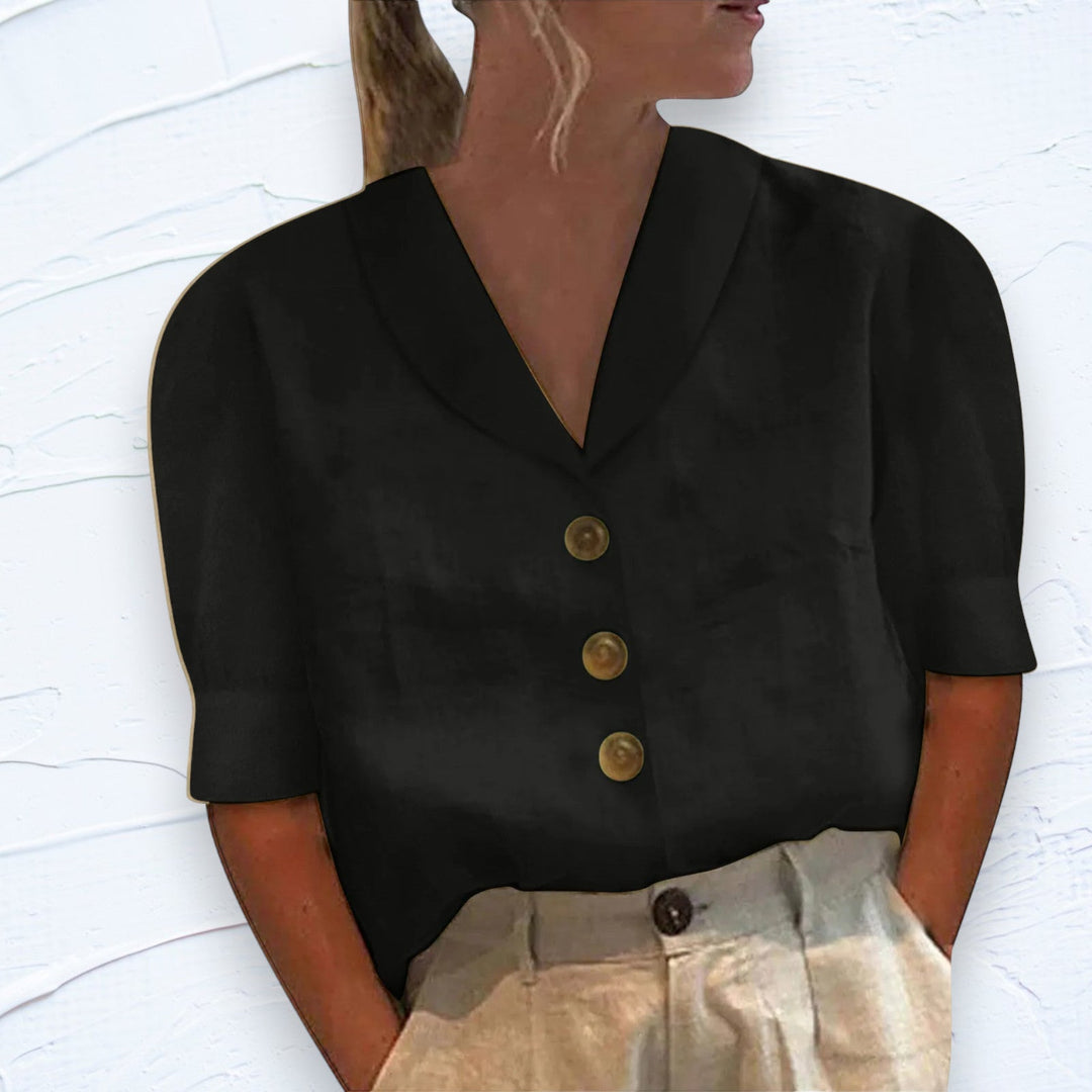 Zwarte elegante dames blouse met kraag en knopen, perfect voor een modieuze klassieke look. Comfortabel en stijlvol.