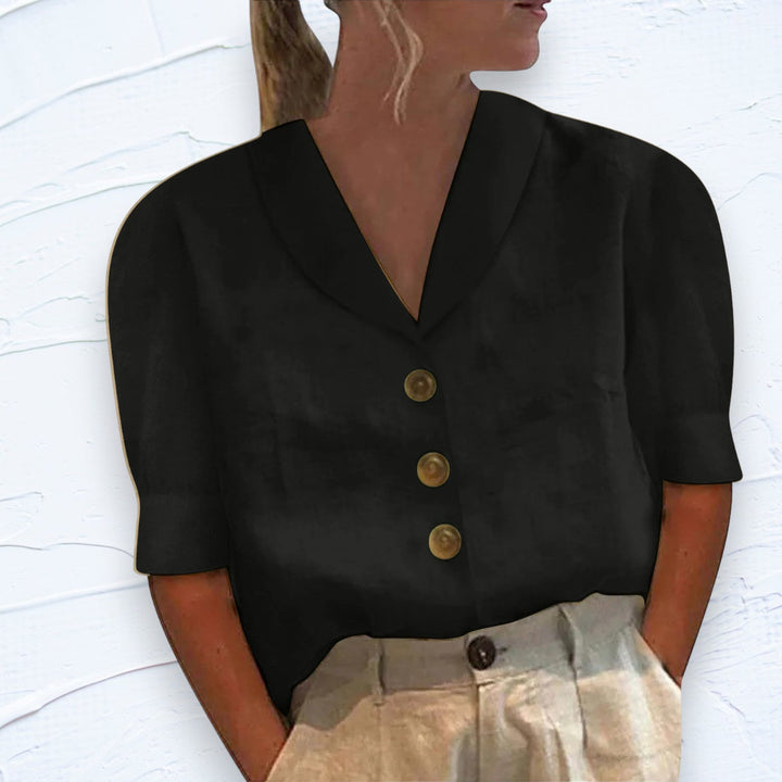 Zwarte elegante dames blouse met kraag en knopen, perfect voor een modieuze klassieke look. Comfortabel en stijlvol.