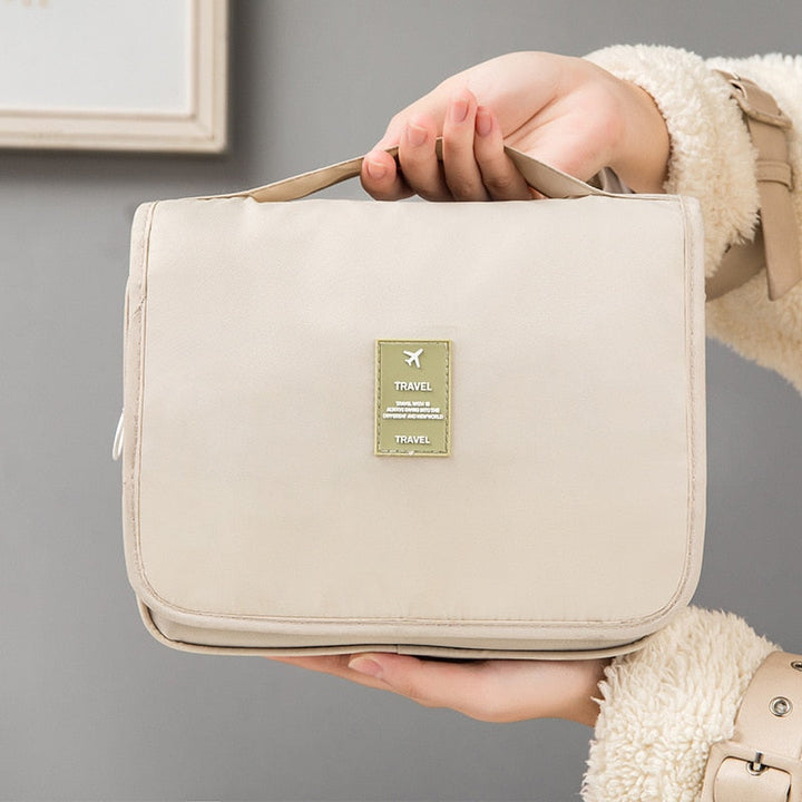 Make-up tas voor dames met handige ritssluitingen en transparante vakken, opvouwbaar design.