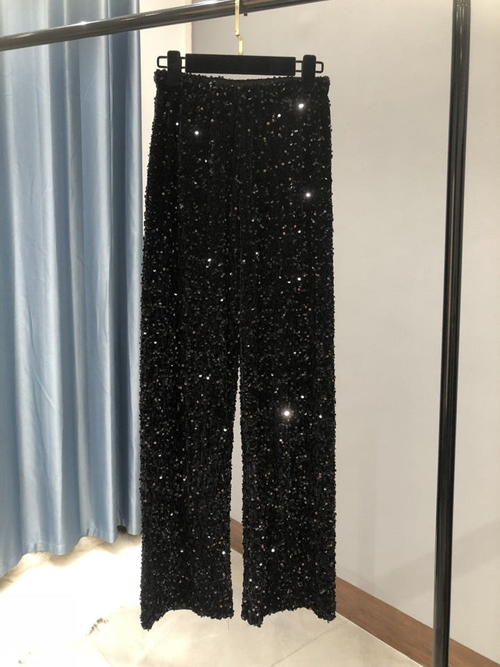 Stijlvolle dames glitter pantalon met wijde pijpen, ideaal voor avondmode en een glamoureuze uitstraling.
