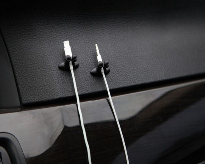 Set van 5 kabel organizers om rondslingerende oplaadkabels op je bureau of nachtkastje te ordenen.