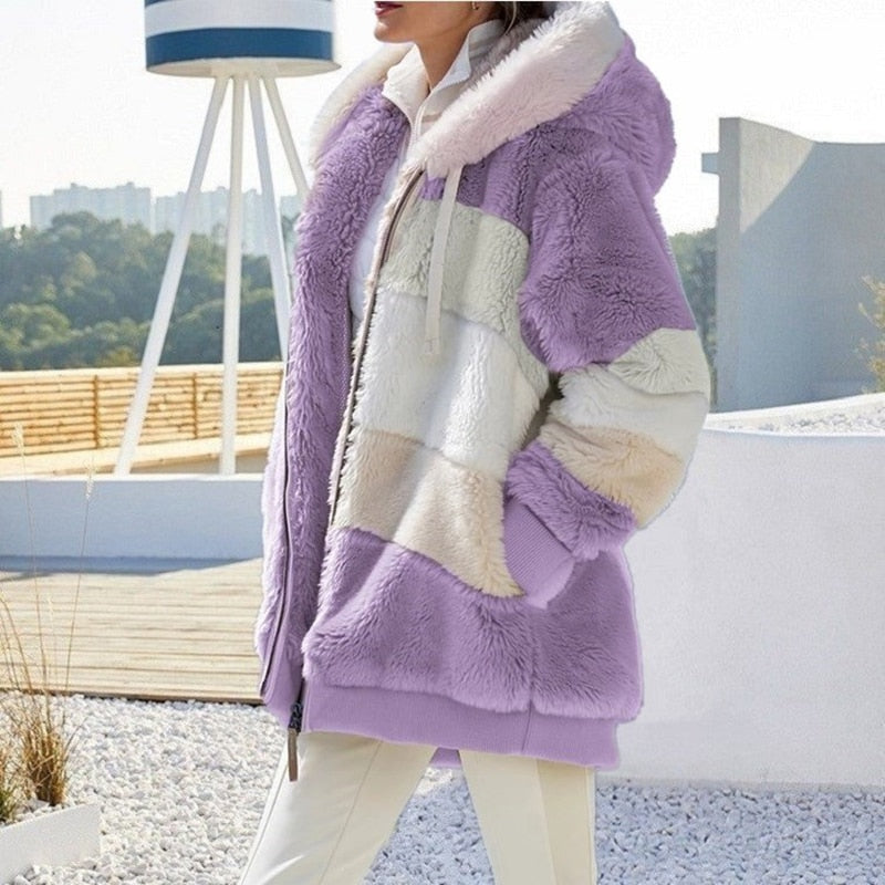 Dames fleece vest met capuchon, warm pluche en modieuze look.