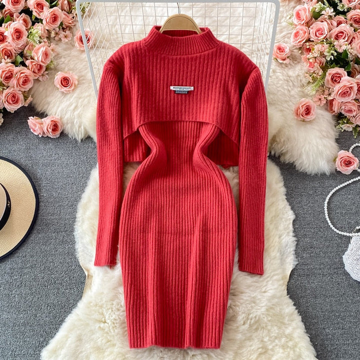 Elegante dames set, een stijlvolle combinatie van trui en jurk met pofmouwen.
