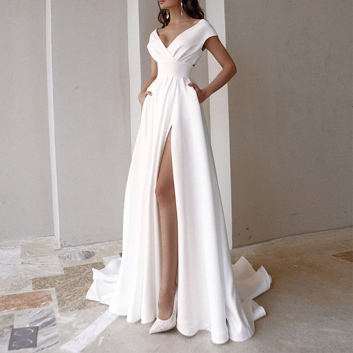 Elegante dames V-hals jurk met chique zijsplit. Perfect voor formele gelegenheden of als avondkleding.