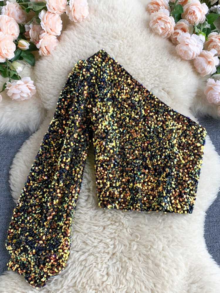 Veelzijdige one-shoulder glitter top voor dames, perfect voor diverse feestelijke gelegenheden.