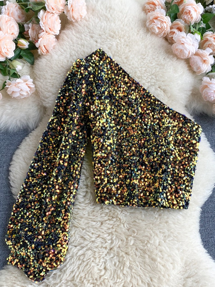 Veelzijdige one-shoulder glitter top voor dames, perfect voor diverse feestelijke gelegenheden.
