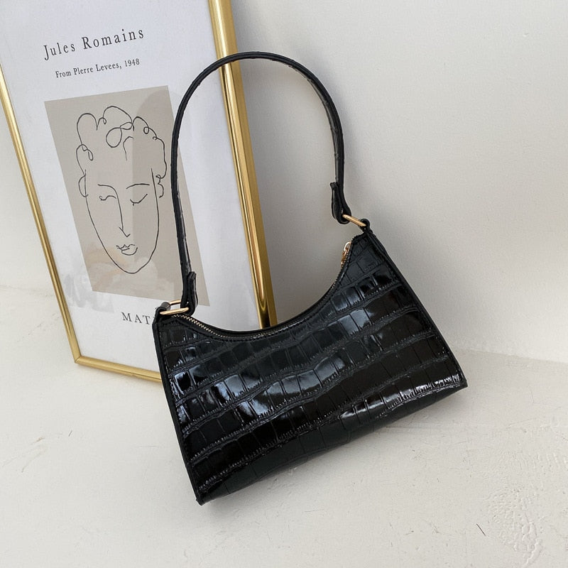 Elegant dames accessoire, deze chique schoudertas maakt je look compleet.