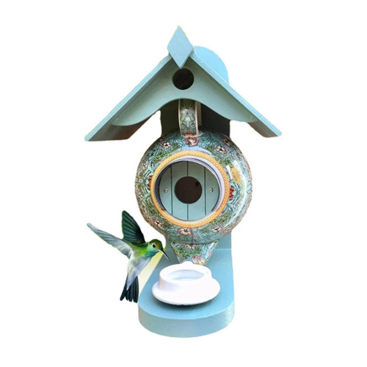 Gedetailleerd theepot vogelvoederhuis met schotel, van keramiek en hars. Ideale tuindecoratie voor vogels.