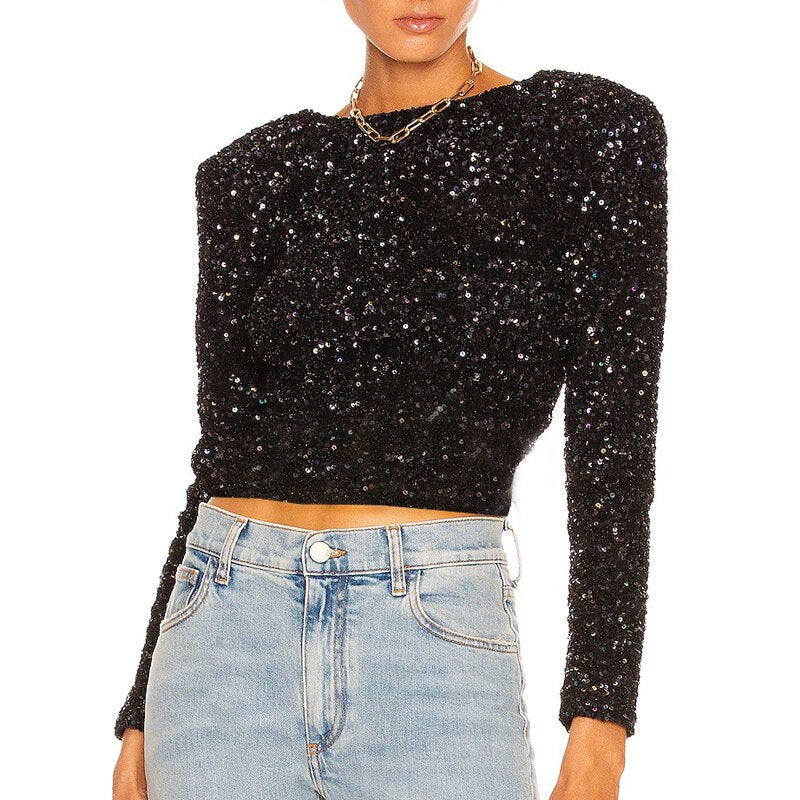 Glitterend zwart kerst topje voor dames. Comfortabele en feestelijke bovenkleding voor de feestdagen.