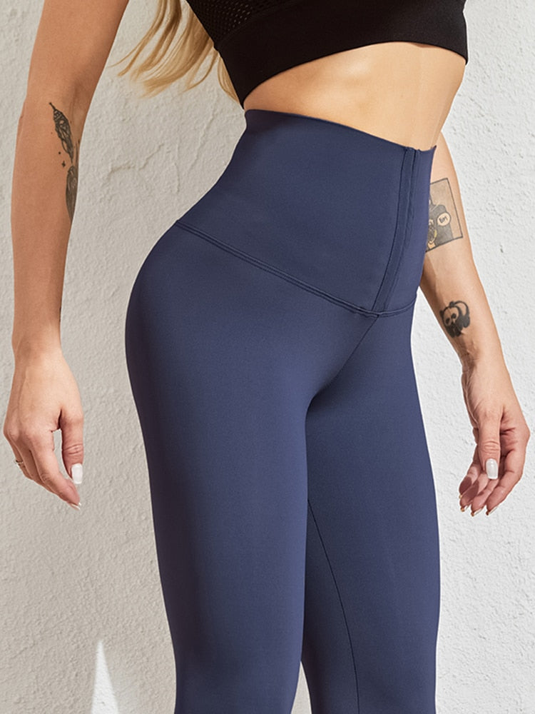 Zwarte dames sportlegging, hoge taille, met functioneel corset voor taille-shaping.