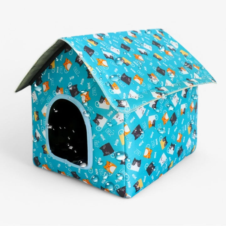 Comfortabel waterdicht kattenhuis Nessa; een warme, beschermde schuilplaats buiten.