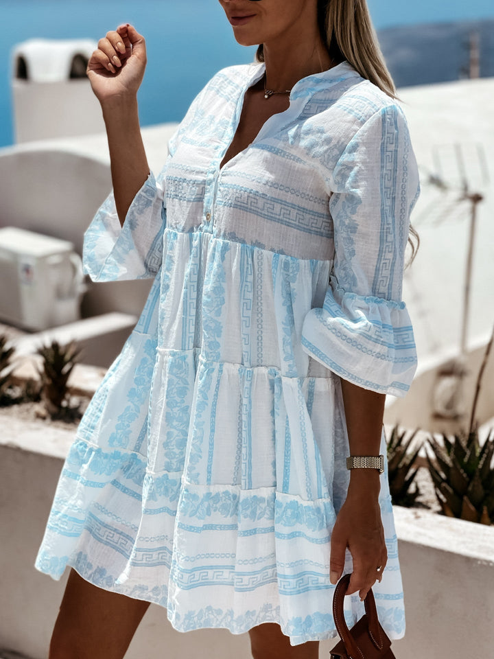 Comfortabele Inna Ibiza Ruffle Dress in groen, met ruches en vrolijk patroon, ideaal voor zomer.