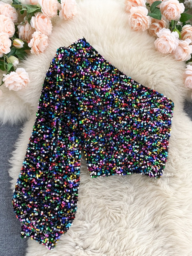 Platliggend shot van de dames glitter one-shoulder top met pailletten, voor productweergave.