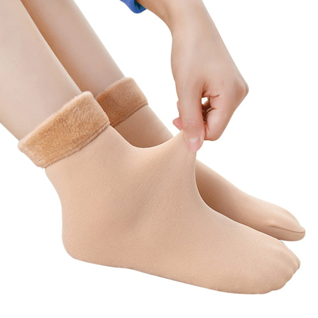 Stapel warme unisex thermosokken, gevoerd voor optimale warmte. Perfect tegen koude voeten in de winter.