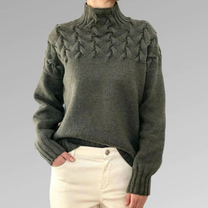 Stijlvolle gebreide damestrui, col en lange pasvorm. Perfect voor winterkleding en casual outfits.