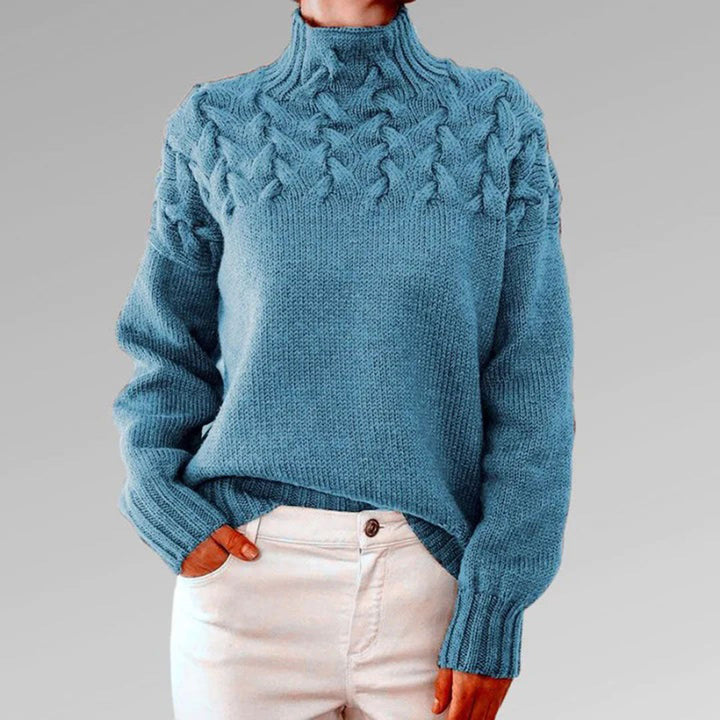 Stijlvolle gebreide damestrui met col, ideaal voor koude dagen. Lange pasvorm en tijdloos design.