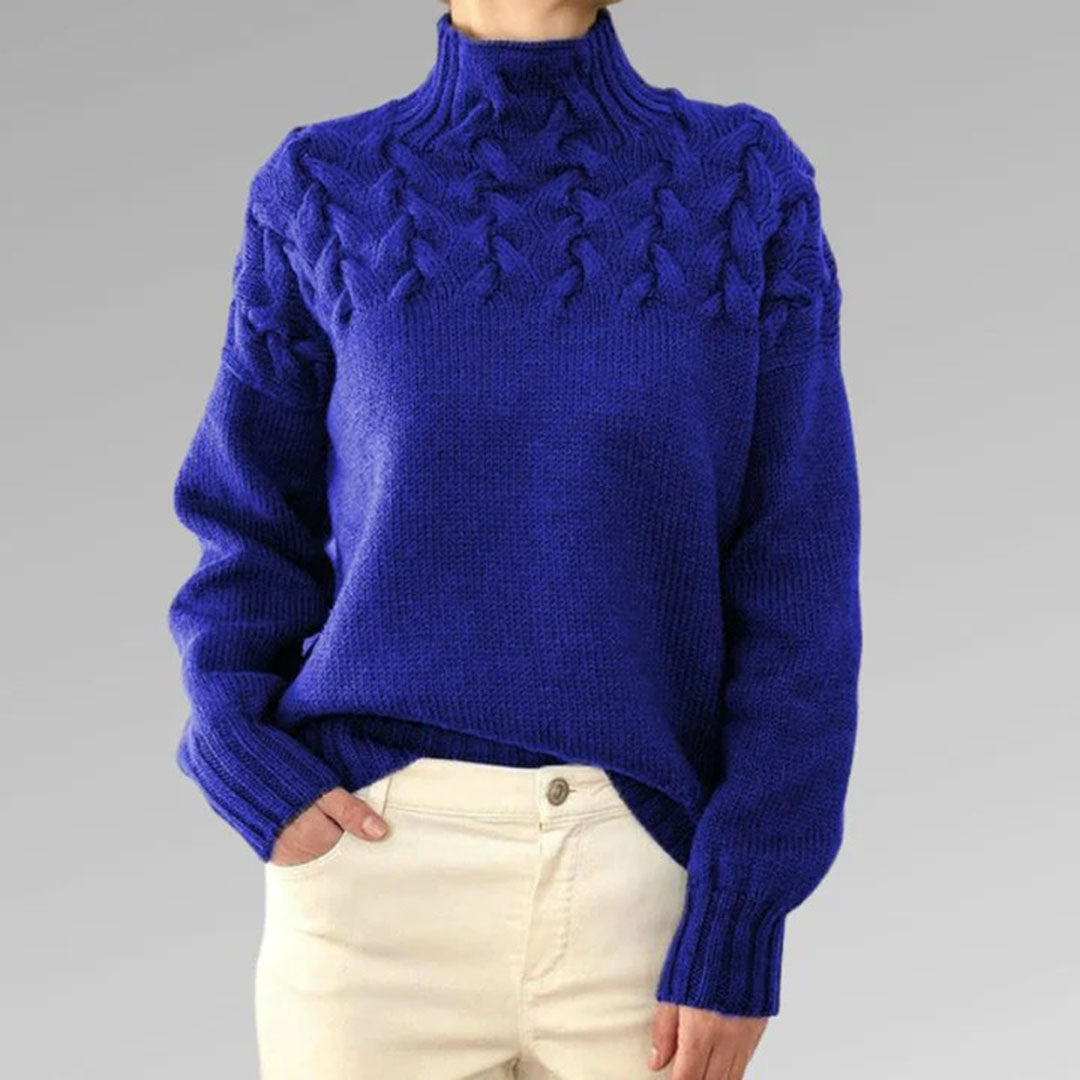 Elegante gebreide damestrui met col. Essentieel voor stijlvolle wintermode, makkelijk te combineren.