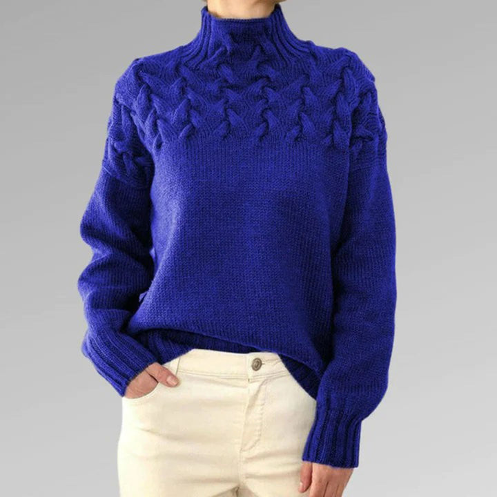 Elegante gebreide damestrui met col. Essentieel voor stijlvolle wintermode, makkelijk te combineren.