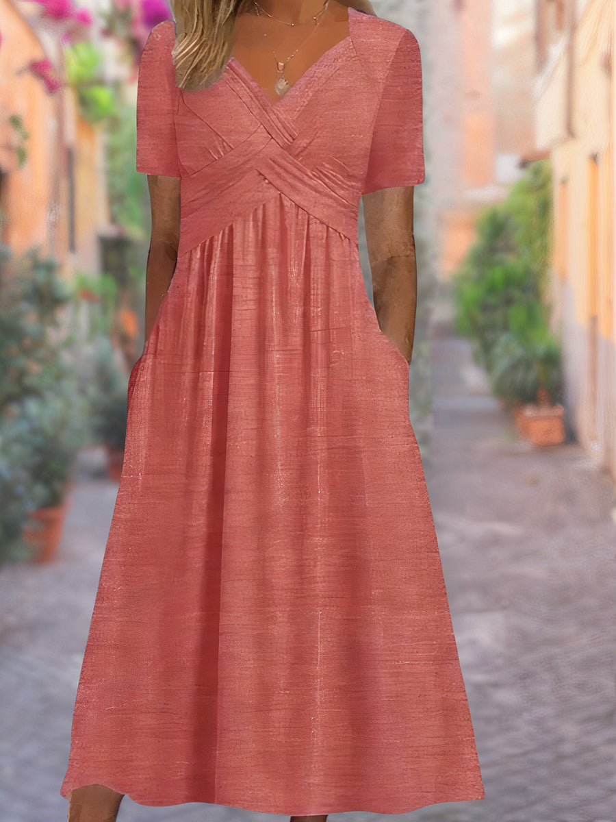 Elegante dameskleding: zomerjurk met V-hals, stijlvol en comfortabel. Geschikt voor feestjes of strand.